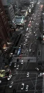 Aerial view of city traffic and skyscrapers at night.