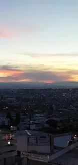 City skyline at dusk with vibrant sunset colors.