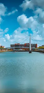 Cityscape with modern bridge and blue sky reflection.