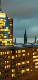 Cityscape wallpaper with glowing windows at dusk.