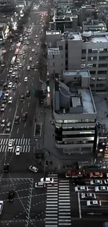 Aerial view of city traffic and buildings in the evening.