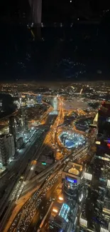 A stunning aerial night view of a cityscape with twinkling lights and tall buildings.