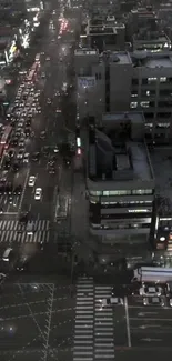 Aerial view of bustling city traffic at night in an urban landscape.