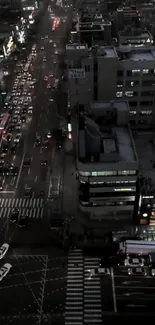 Aerial view of bustling city street at night.