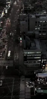 Aerial view of cityscape with night traffic lights.