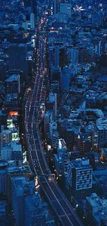 Nighttime cityscape with blue illumination and busy streets.