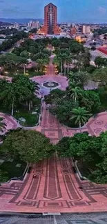 A scenic city view with a park pathway surrounded by lush greenery.