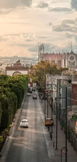 A tranquil city street leading to a Gothic cathedral, with cloudy skies overhead.