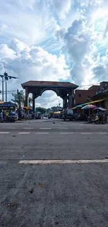 Vibrant street market under cloudy skies.