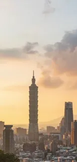 Dramatic cityscape with tower during golden sunset.