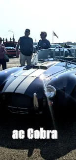 Classic AC Cobra at an outdoor car show.