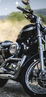 Classic black motorcycle with chrome details on a scenic outdoor setting.