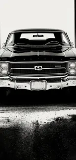 Monochrome wallpaper featuring a classic black muscle car, front view.