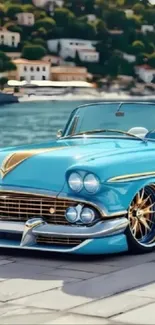 Classic blue convertible by a lakeside with scenic view, showcasing elegance and style.