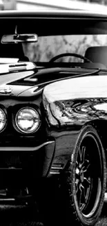 Vintage muscle car in black and white with a classic, elegant design.