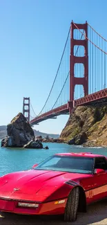 Red classic car with Golden Gate Bridge backdrop.