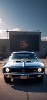 Classic muscle car parked at drive-in with vintage setting under clear sky.