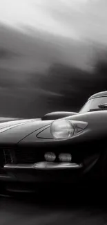 A classic car racing on a blurred road with motion effects in grayscale tones.