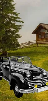 Classic black car with countryside cabin and lush green scenery.