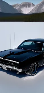 Classic black car on snowy mountain road, peaceful scenery.