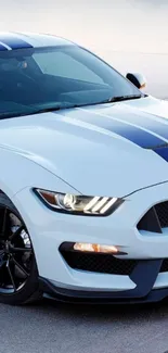 White sports car with blue stripes on a modern mobile wallpaper.