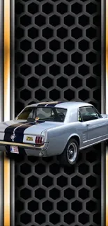 Classic Ford Mustang against black and metallic patterned wallpaper.