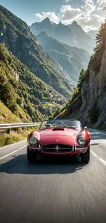 Classic red convertible car driving on scenic mountain road.