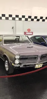 Purple classic muscle car in showroom with vintage appeal.