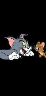 Cartoon cat and mouse on black background wallpaper.