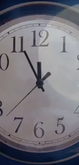 Classic analog clock face with navy blue accents.