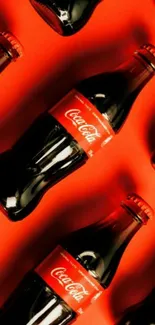 Coca-Cola bottles on vibrant red background, classic design.