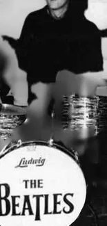 Black and white image of a classic drummer with vintage drum kit.