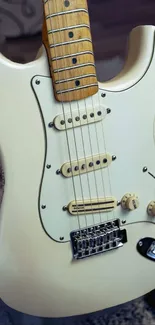 Close-up of a classic cream electric guitar.