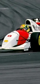 Classic Formula 1 car racing on track.