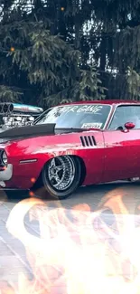 Wallpaper of a classic red muscle car parked on pavement.