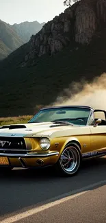 Yellow classic Mustang convertible on mountain road at sunset.