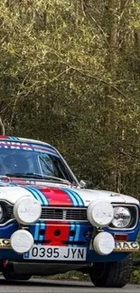 Classic rally car on a forest road.