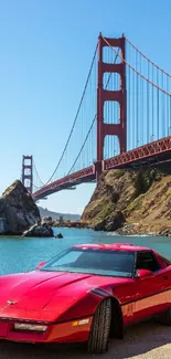 Classic red car with Golden Gate Bridge background.