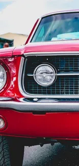 Vibrant red classic car mobile wallpaper featuring stunning automotive design.