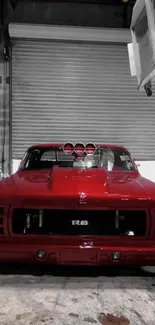 Classic red muscle car parked in a garage with shutters.