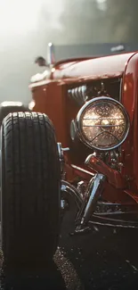 Close-up of a classic red vintage car on a road.