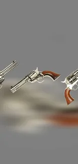 Three classic revolvers on a gray background for mobile wallpaper.