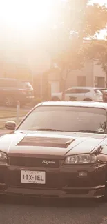 Classic Skyline car on a sunlit street at sunset.