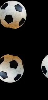 Black background with classic soccer balls design.