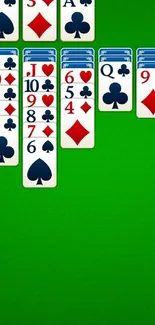 Classic solitaire layout on a green background with card suits.