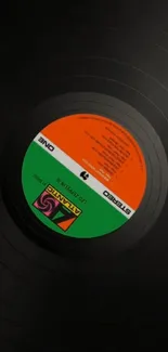 Upside-down vinyl record with colorful label design.