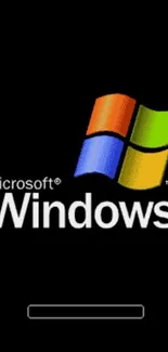 Iconic Windows XP logo on black background.