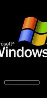 Classic Windows XP wallpaper with Microsoft logo on a black background.