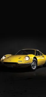 Yellow classic sports car on a black background - mobile wallpaper.