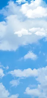 Peaceful blue sky with fluffy clouds wallpaper.